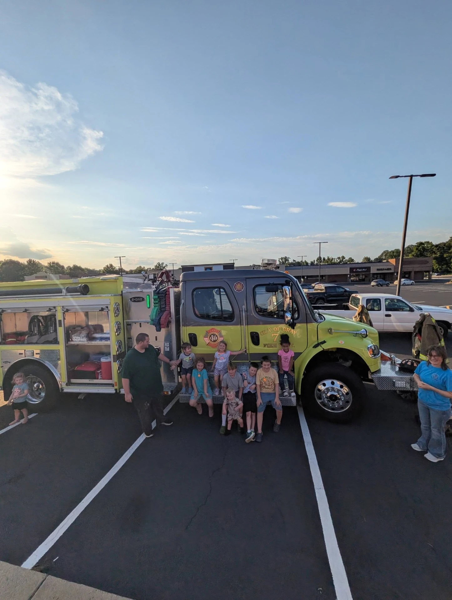 Climbing aboard with the firefighters.