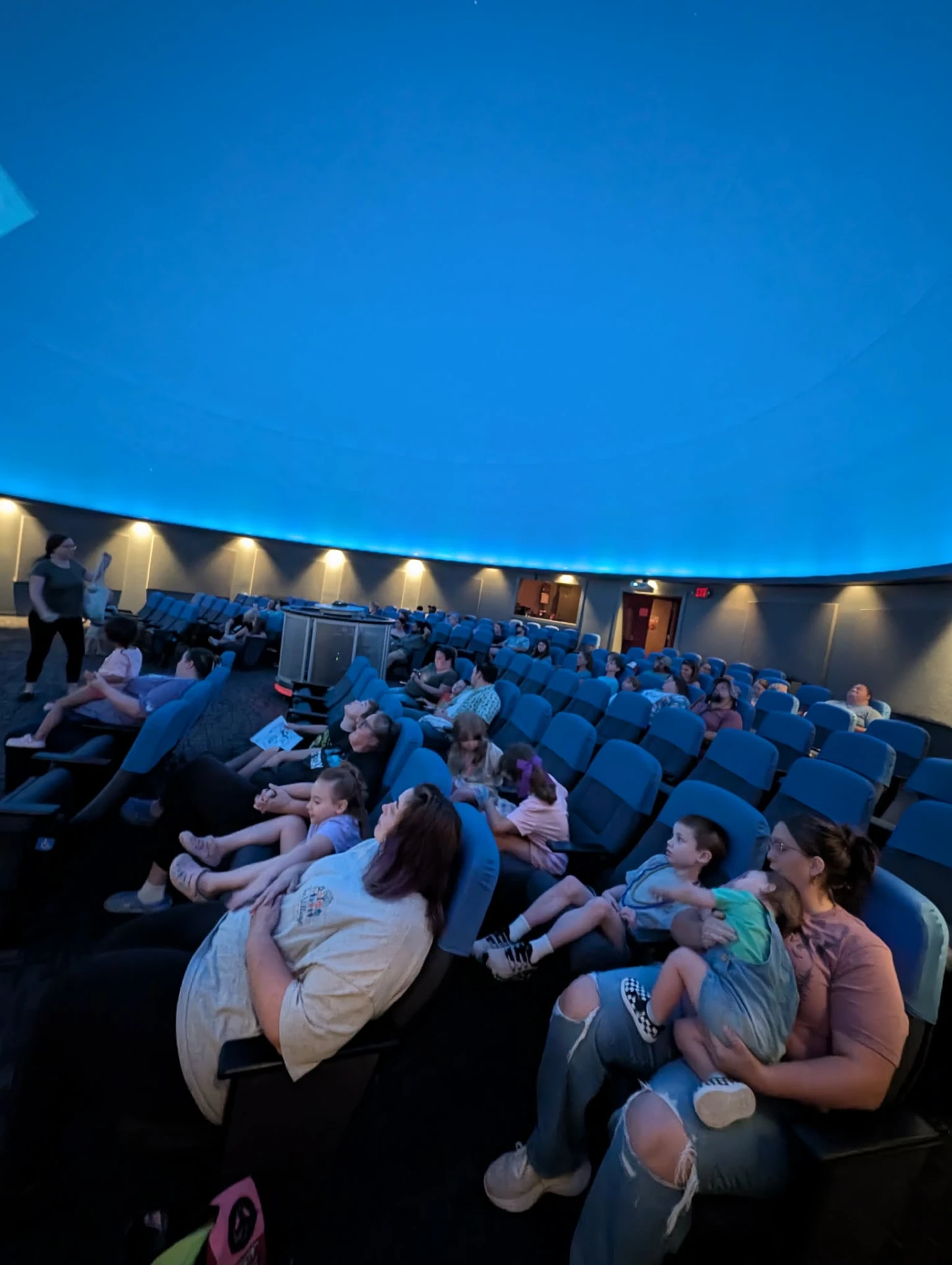 Taking in the stars together at the planetarium.